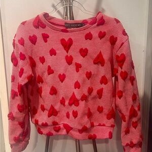 Red Heart Sweater by UK designers Vinti Andrew.
In great condition.